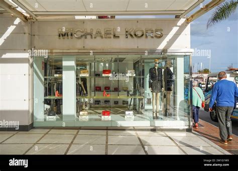 is michael kors high end brand